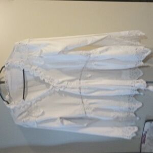 White embroided blouse with big sleeves, V neck with bow.